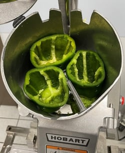 Prepping vegetables for a Hobart food processor