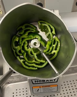 Prepping vegetables for a Hobart food processor