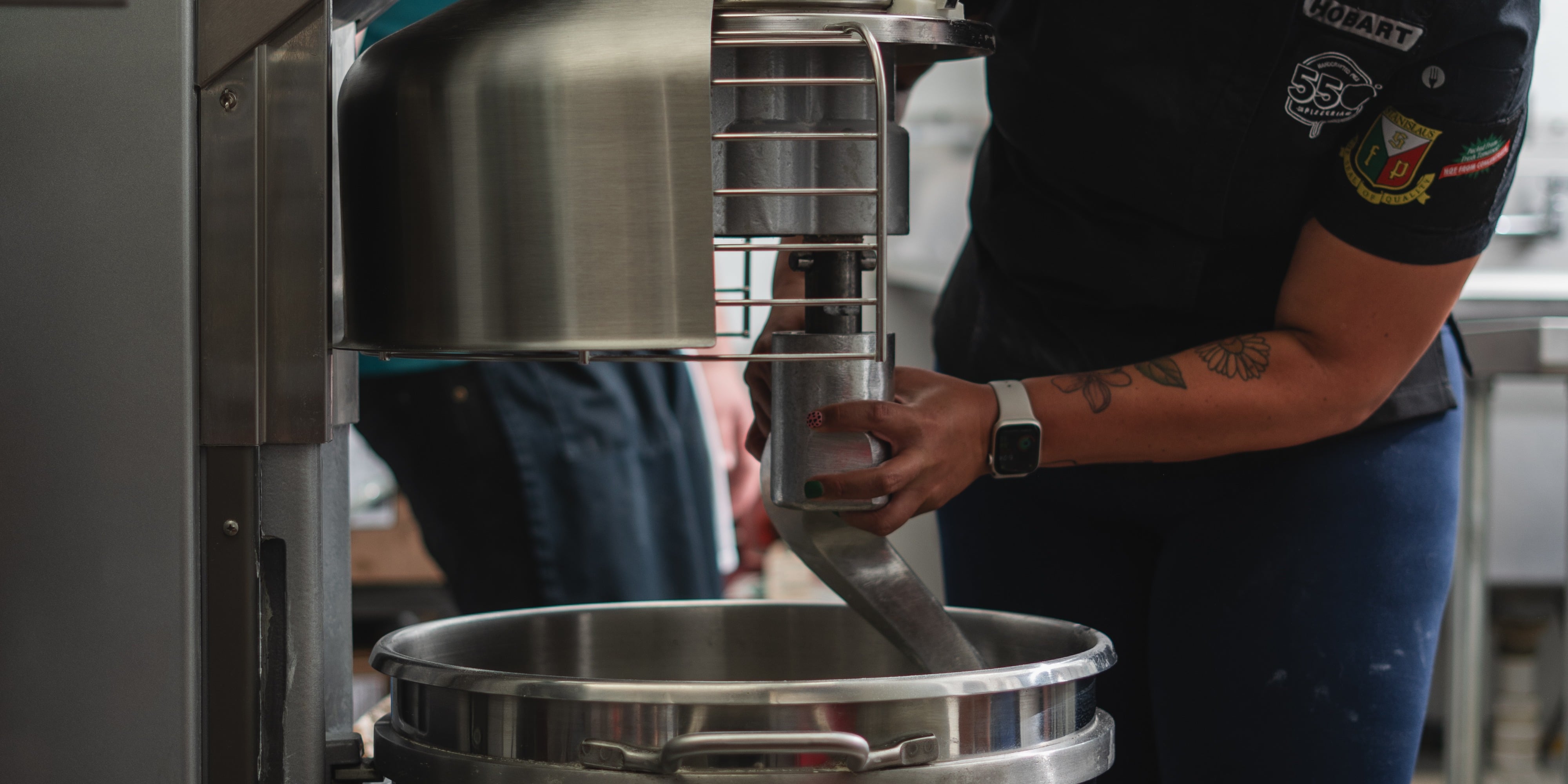 A dough hook is installed on a Hobart commercial pizza mixer