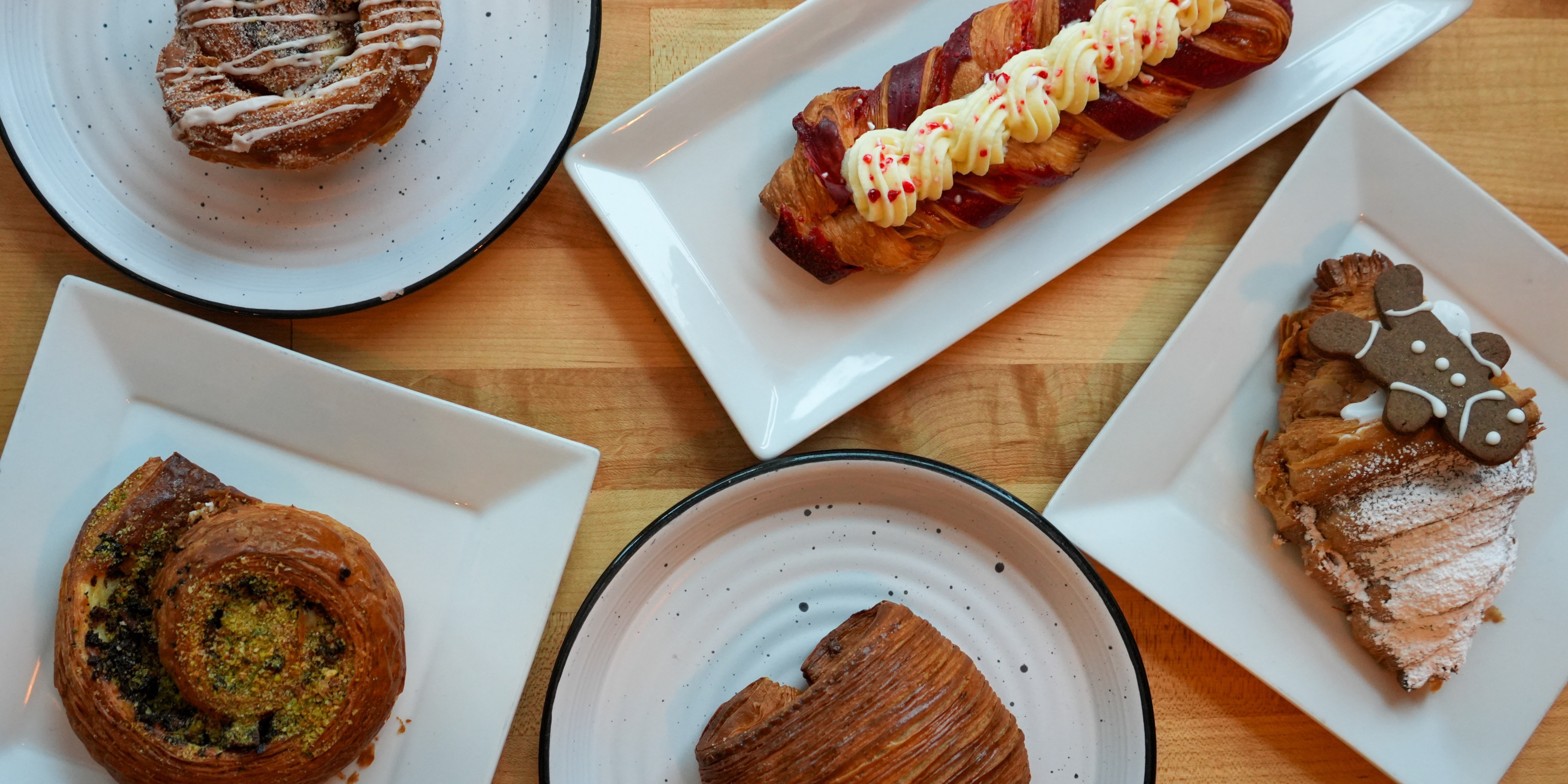 White plates with pastries from Artisan Bakery